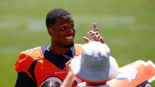 Denver Broncos defensive tackle Jonathan Harris (92) greets fans after training camp at Centura Health Training Center.